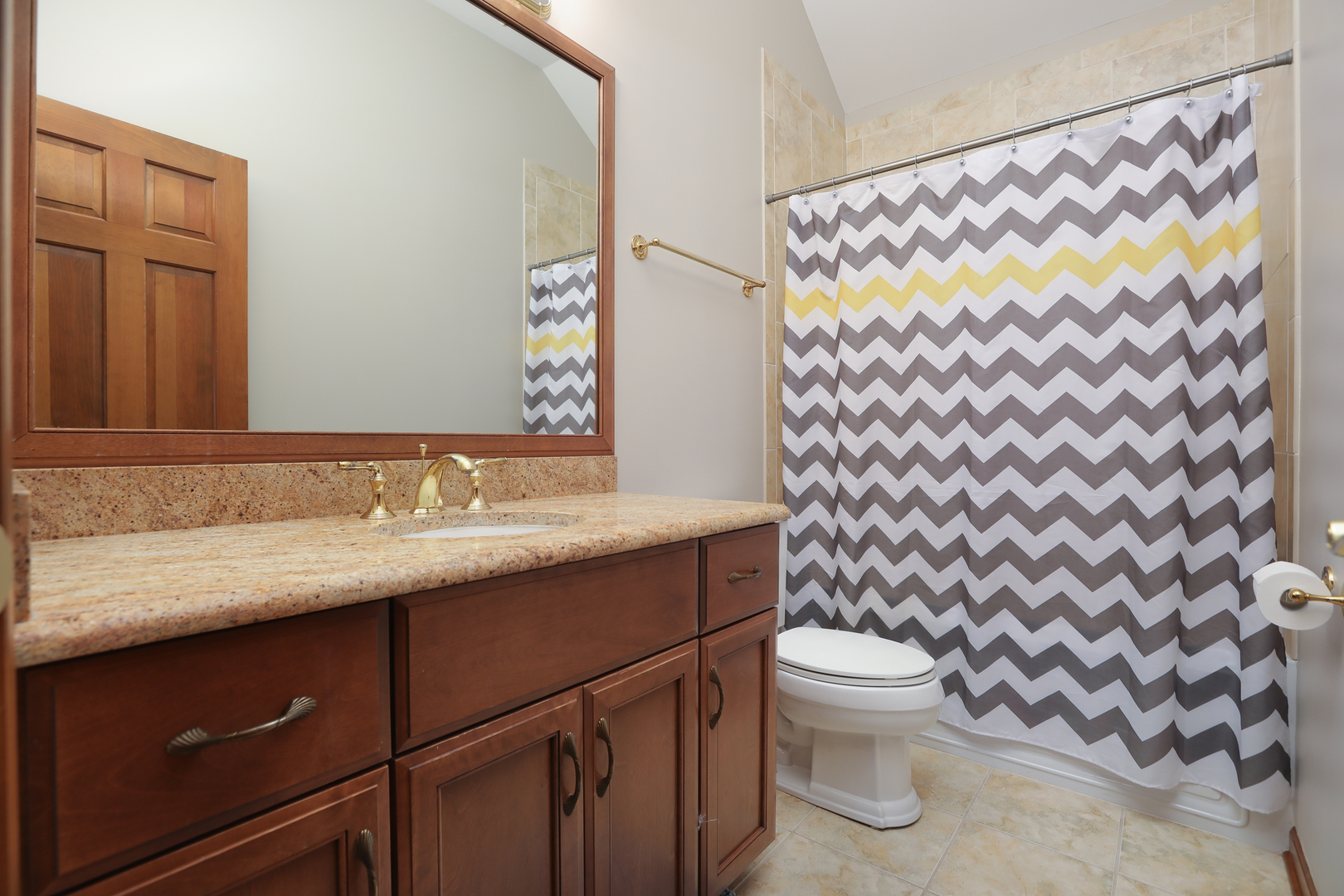 23W250 Hampton Circle Naperville, IL 60540 - Photo 32 of 42 a bathroom with a granite countertop sink a toilet and a mirror