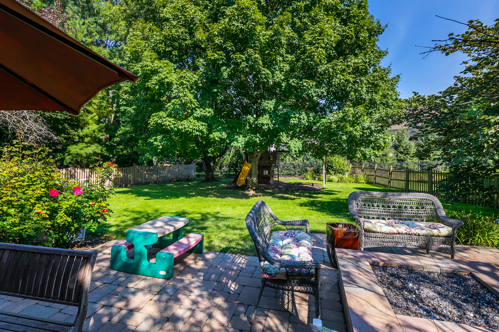 23W250 Hampton Circle Naperville, IL 60540 - Photo 42 of 42 a view of a chair and table in the garden