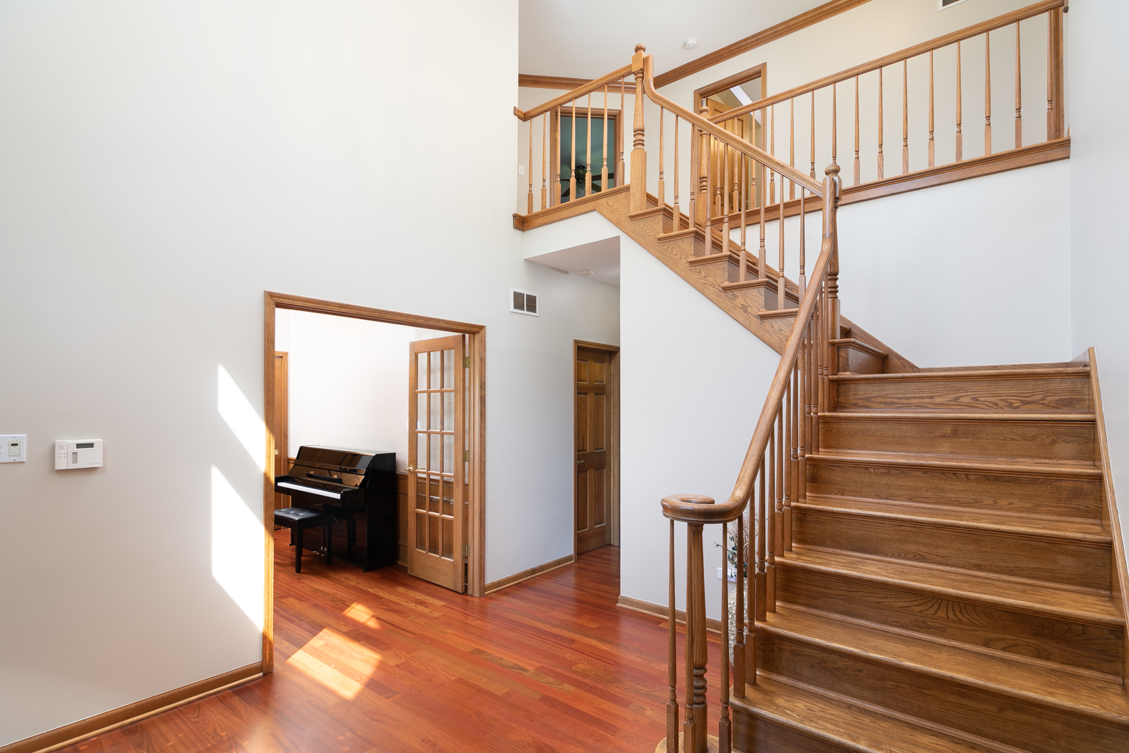 23W250 Hampton Circle Naperville, IL 60540 - Photo 8 of 42 a view of entryway and hall with wooden floor