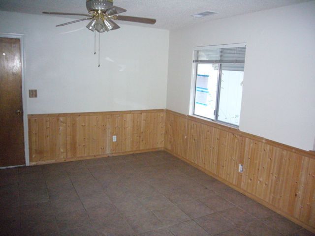 4559 Cedars Road Redding, CA 96001 - Photo 3 of 12 an empty room with chandelier fan