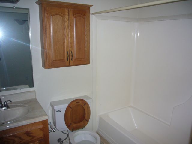 4559 Cedars Road Redding, CA 96001 - Photo 5 of 12 a bathroom with a sink and a mirror