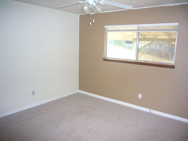 4559 Cedars Road Redding, CA 96001 - Photo 6 of 12 an empty room with a window
