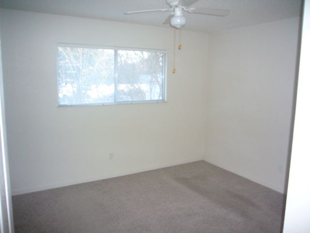 4559 Cedars Road Redding, CA 96001 - Photo 7 of 12 an empty room with a window
