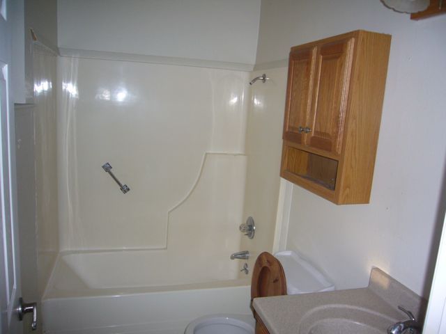 4559 Cedars Road Redding, CA 96001 - Photo 8 of 12 a bathroom with a shower and a toilet