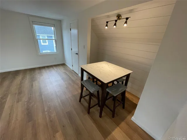 a room with wooden floor and a table