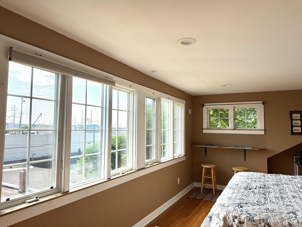 16 Middle Street Fairhaven, MA 02719 - Photo 15 of 34 a bedroom with furniture and a large window