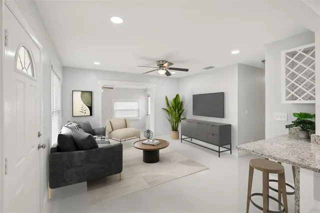 a kitchen with stainless steel appliances white cabinets and white appliances
