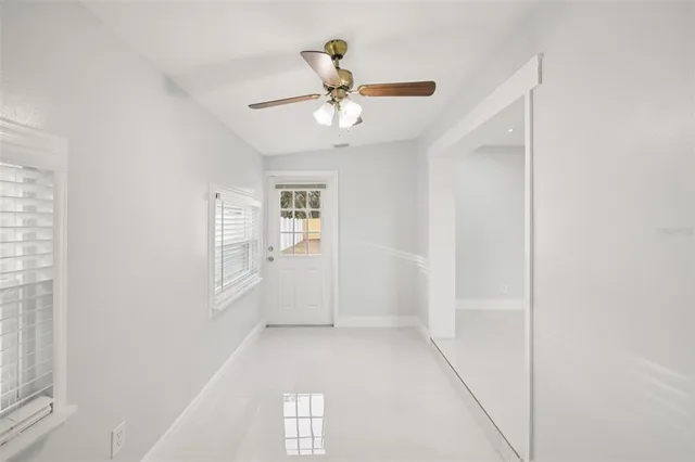 a kitchen with granite countertop kitchen island a table and chairs in it