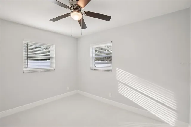 a bathroom with a sink and a window