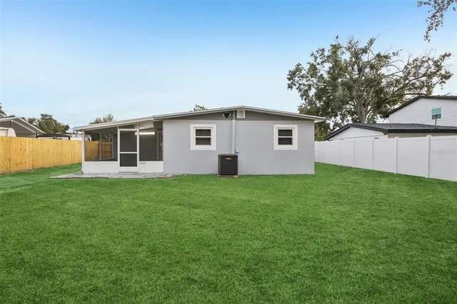 a backyard of a house with lots of green space