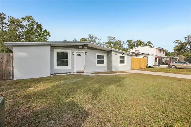 a house with trees in the background