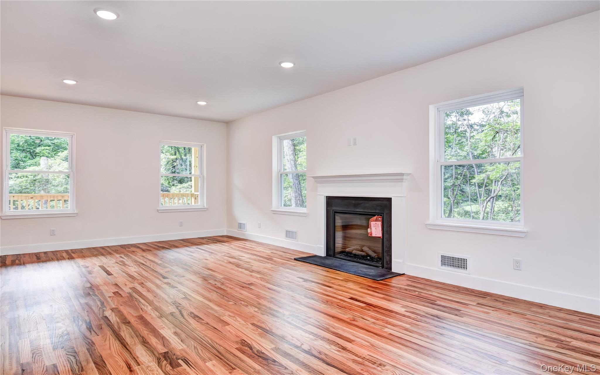 20 Wells Road Newburgh, NY 12550 - Photo 17 of 47 an empty room with windows and fireplace