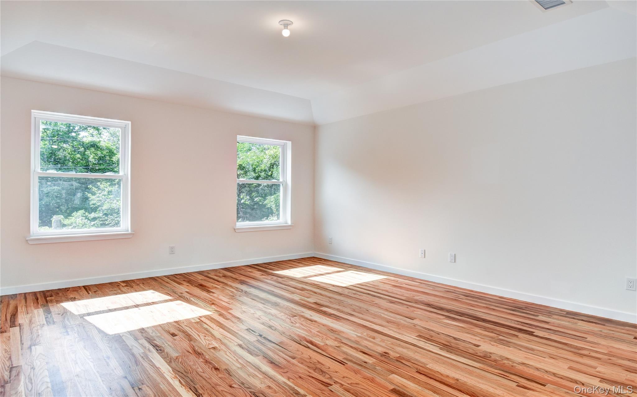 20 Wells Road Newburgh, NY 12550 - Photo 19 of 47 an empty room with wooden floor and windows