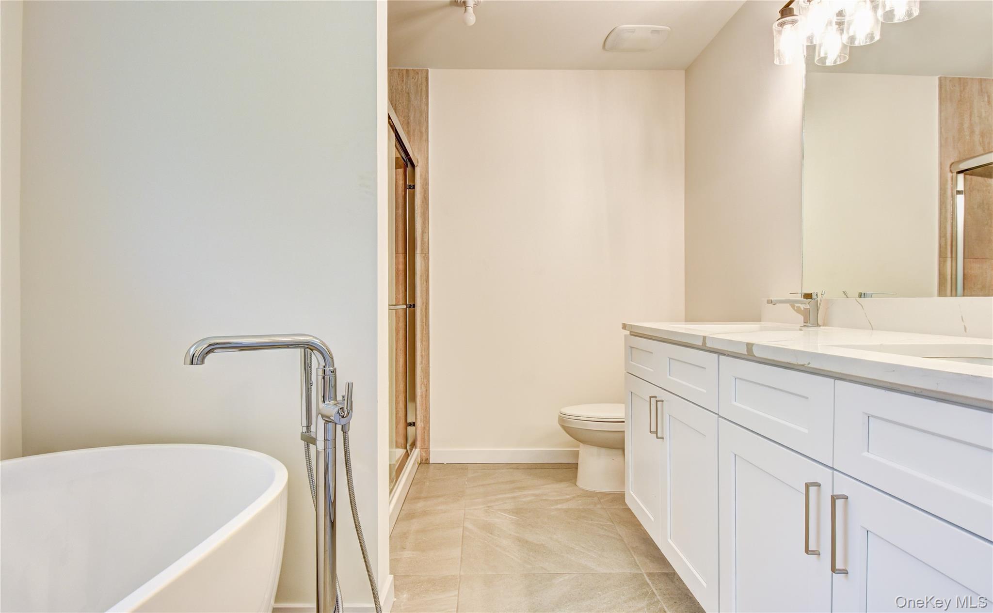 20 Wells Road Newburgh, NY 12550 - Photo 22 of 47 a bathroom with a sink a toilet and a bathtub