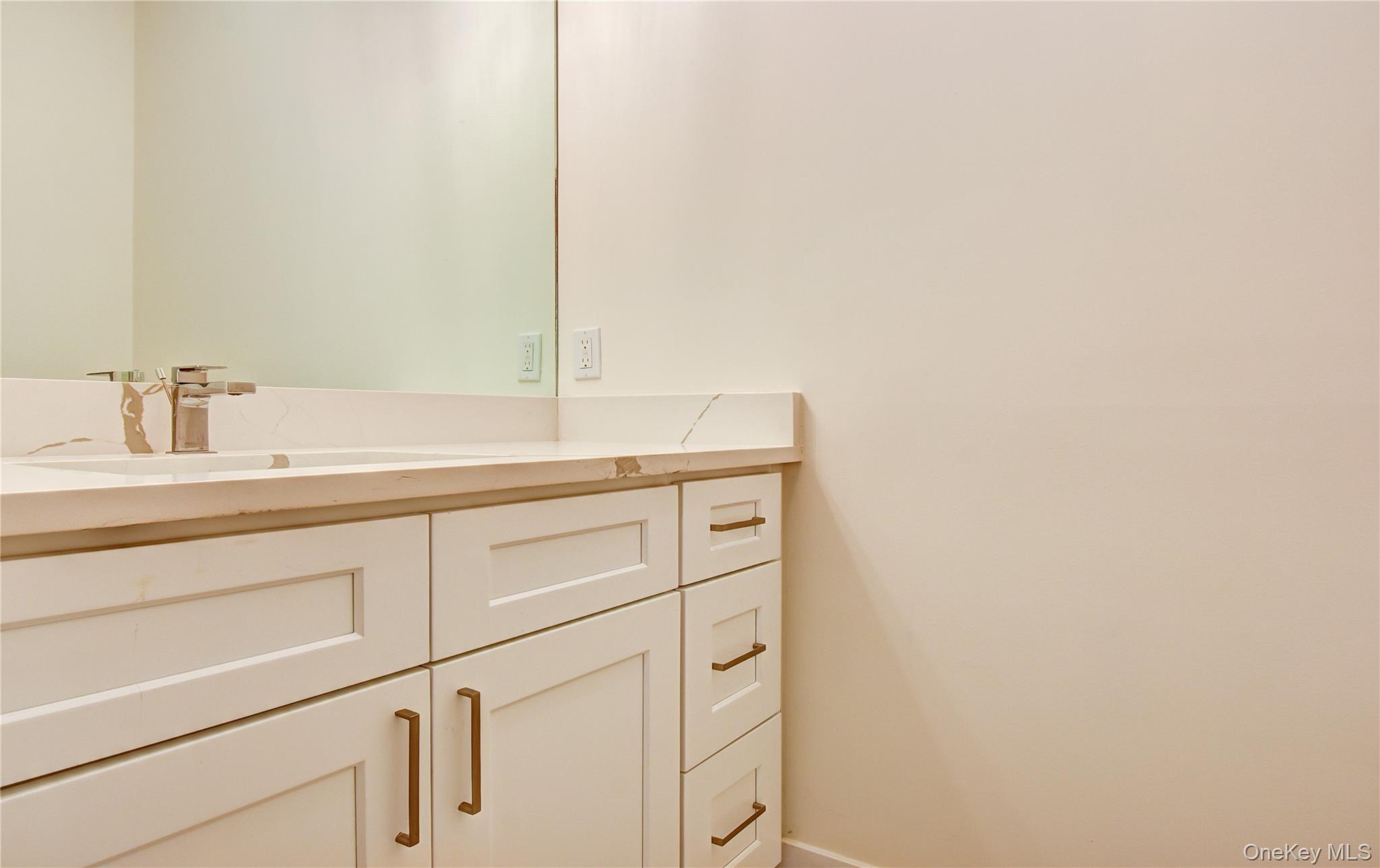 20 Wells Road Newburgh, NY 12550 - Photo 24 of 47 a bathroom with a sink and a mirror