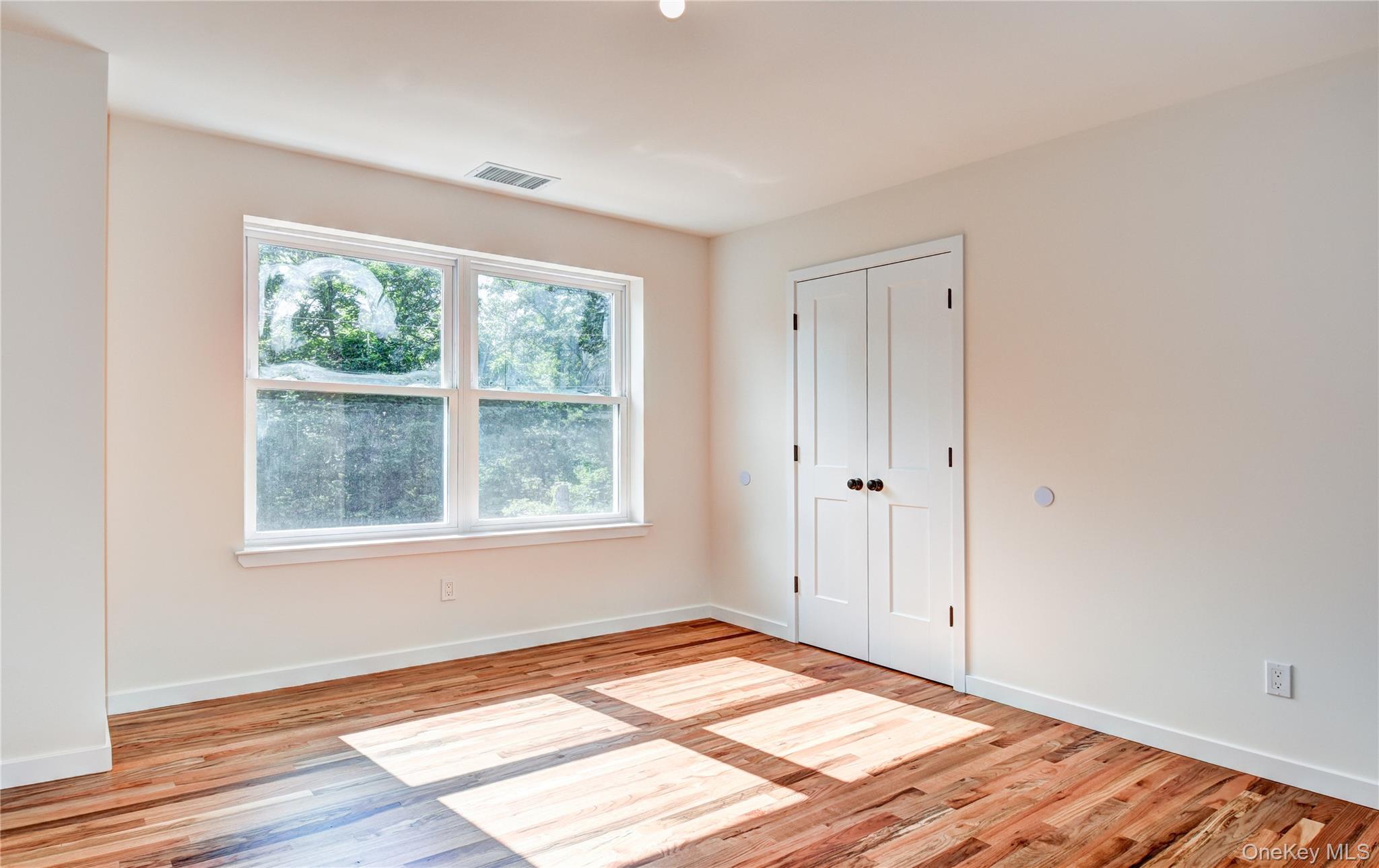 20 Wells Road Newburgh, NY 12550 - Photo 28 of 47 a view of an empty room with wooden floor and a window