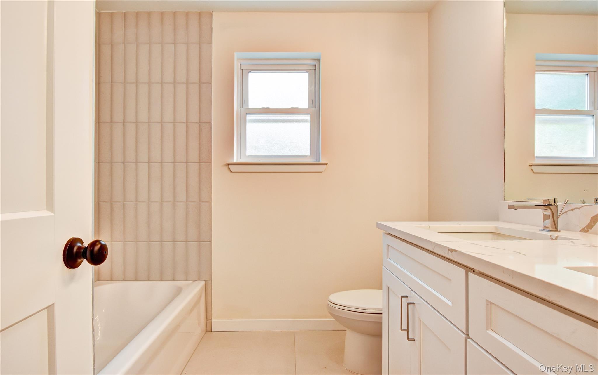 20 Wells Road Newburgh, NY 12550 - Photo 29 of 47 a bathroom with a sink toilet vanity and tub