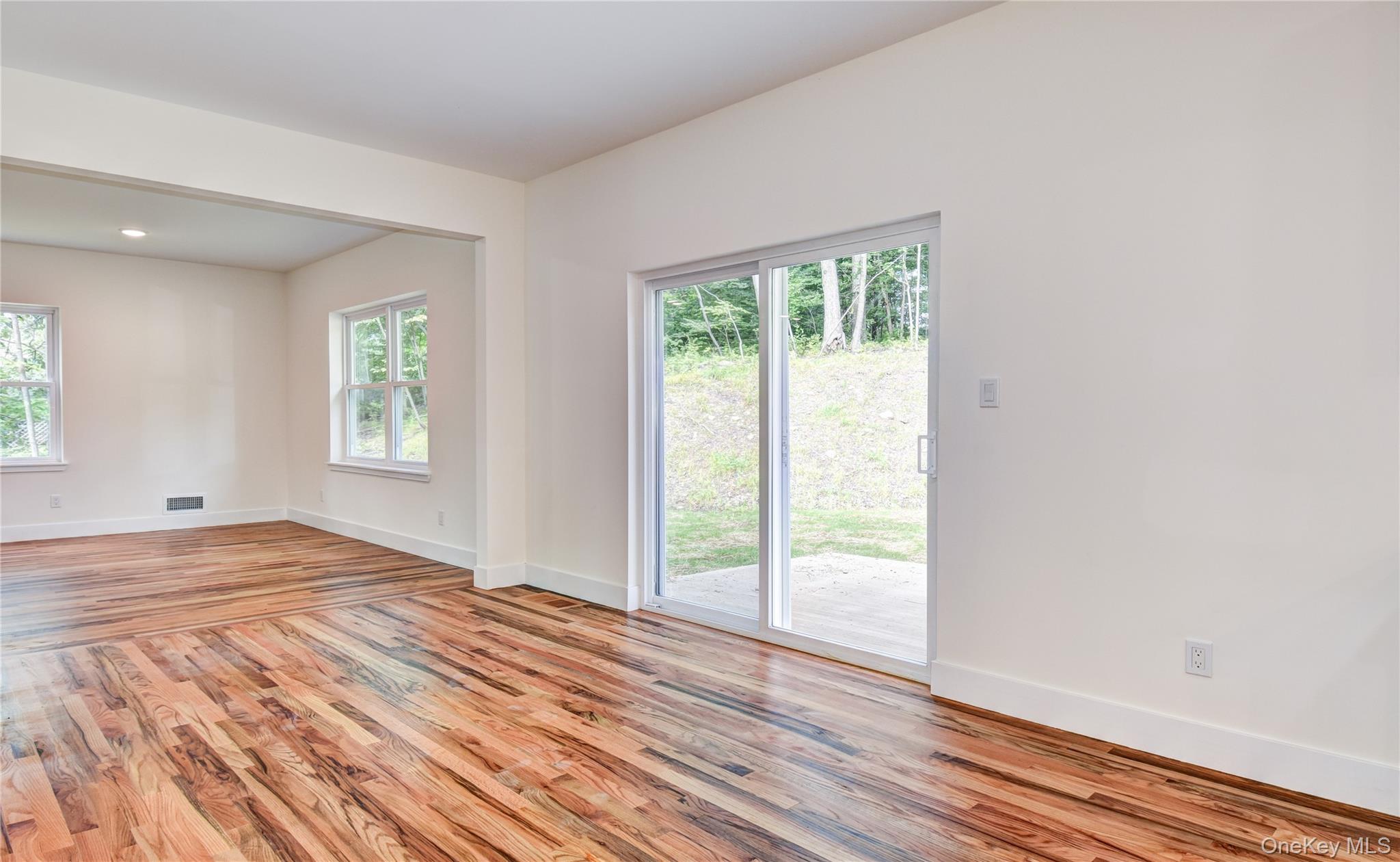 20 Wells Road Newburgh, NY 12550 - Photo 37 of 47 a view of an empty room with wooden floor and a window