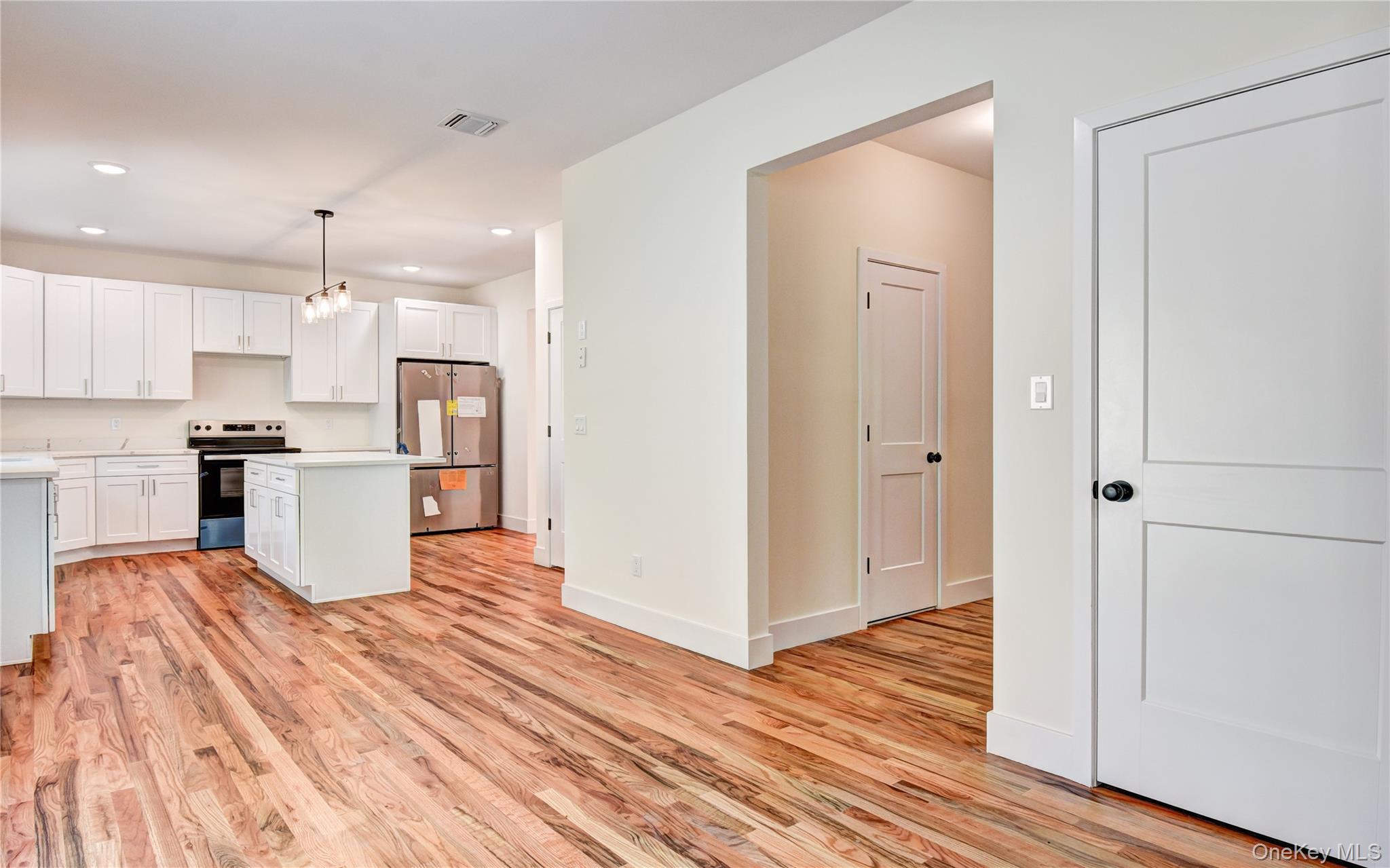 20 Wells Road Newburgh, NY 12550 - Photo 38 of 47 a kitchen with stainless steel appliances granite countertop a refrigerator and a stove top oven