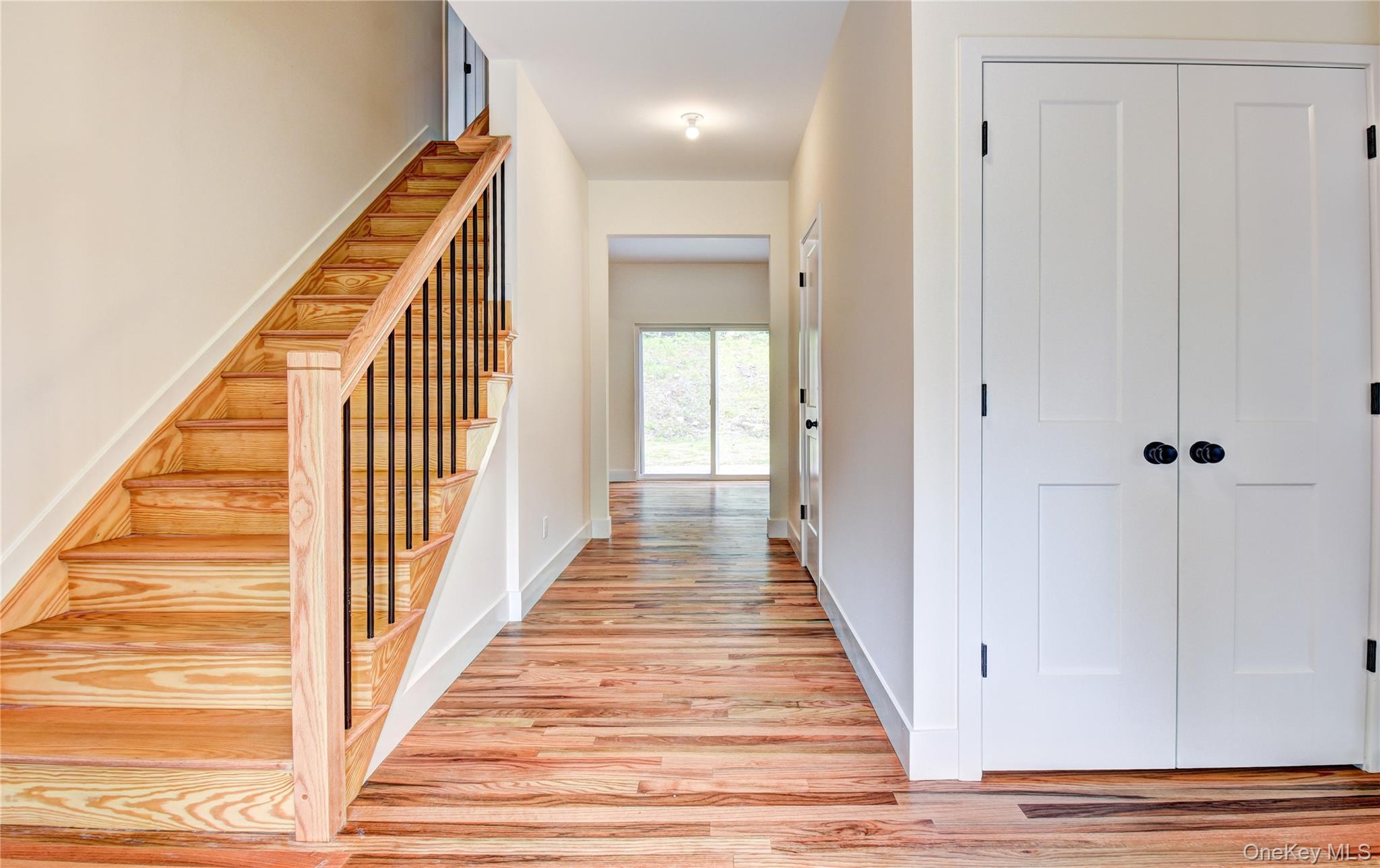 20 Wells Road Newburgh, NY 12550 - Photo 4 of 47 a view of a hallway with wooden floor and staircase