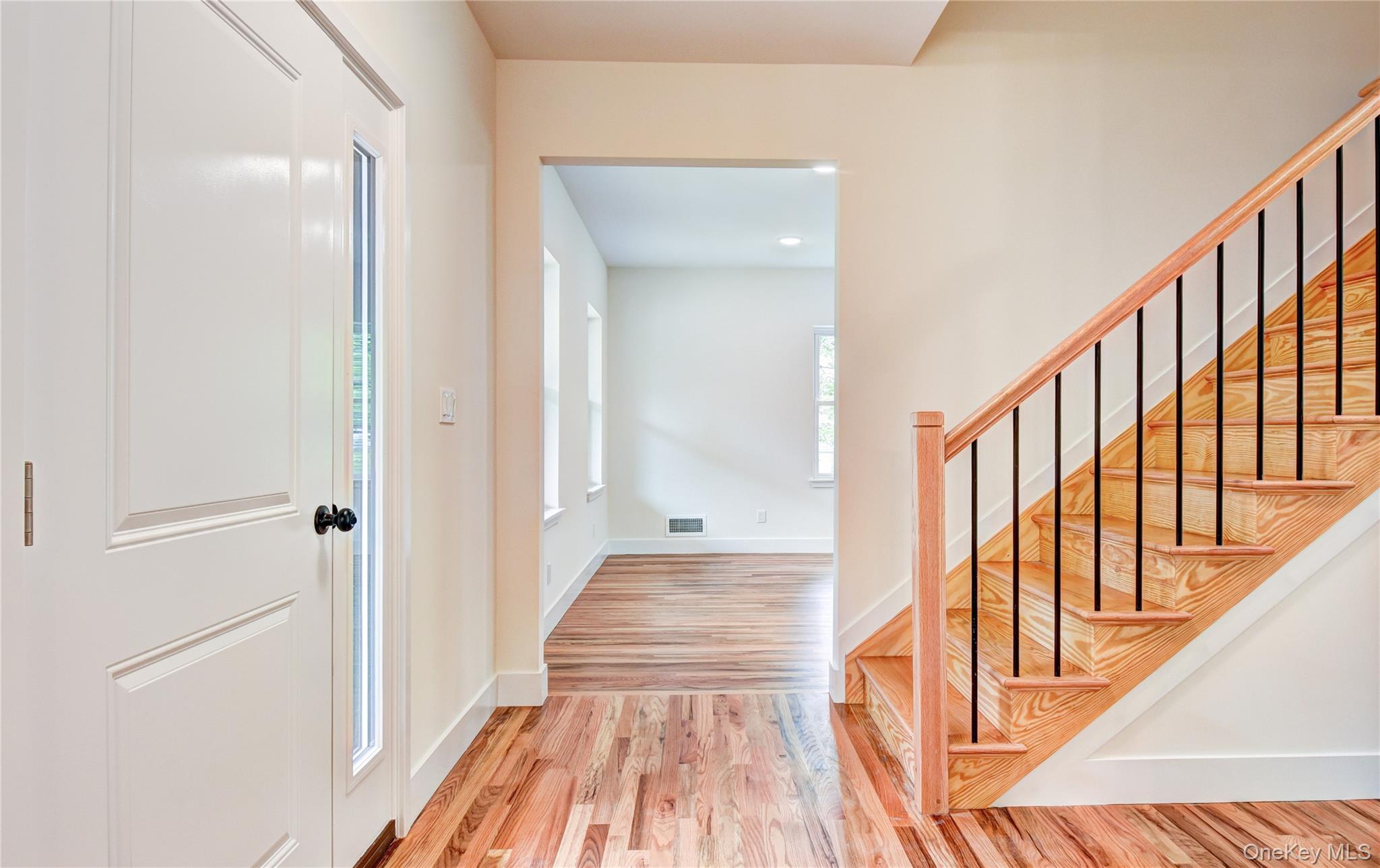 20 Wells Road Newburgh, NY 12550 - Photo 5 of 47 a view of a hallway with wooden floor and staircase