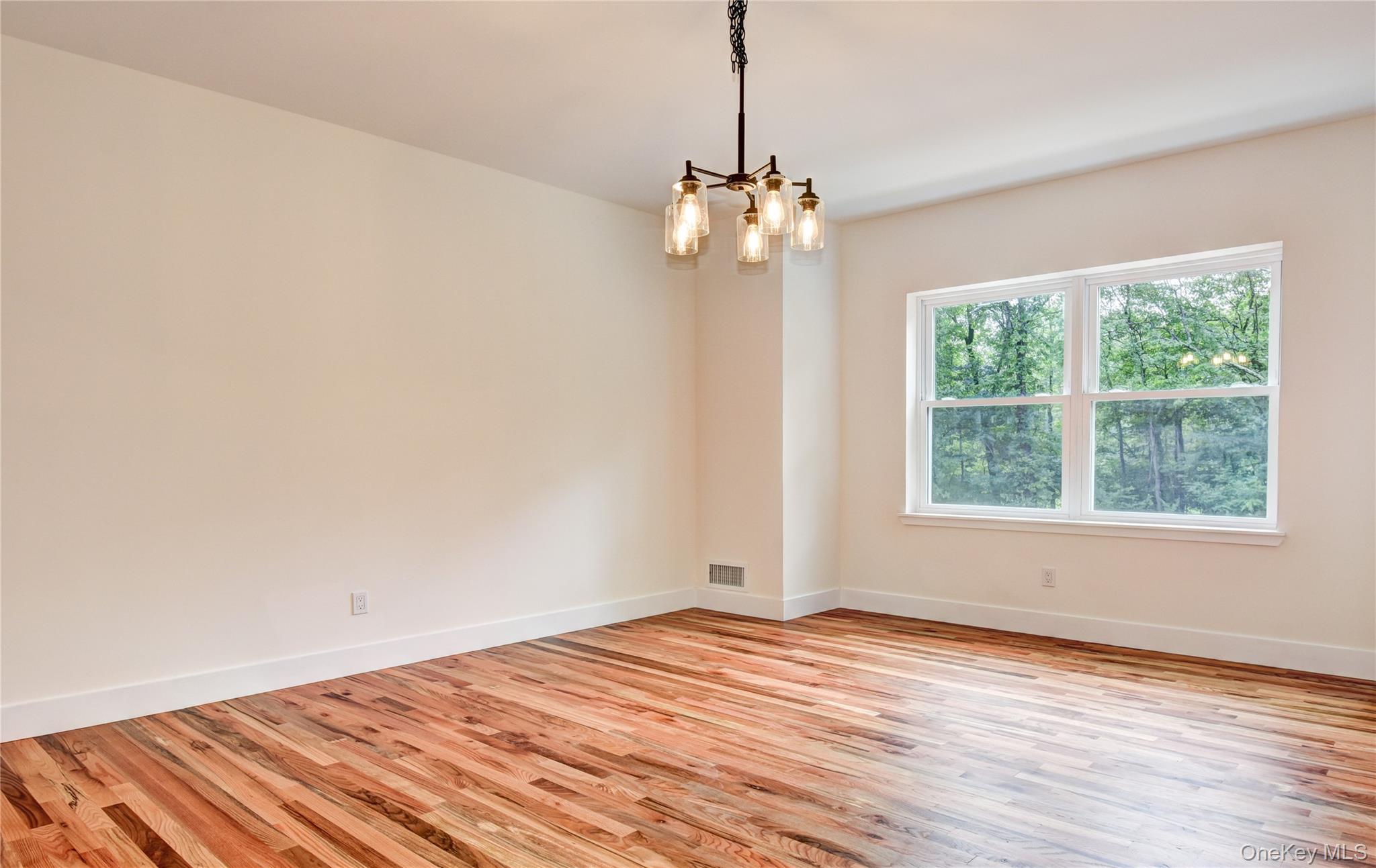 20 Wells Road Newburgh, NY 12550 - Photo 7 of 47 a view of empty room with wooden floor and fan