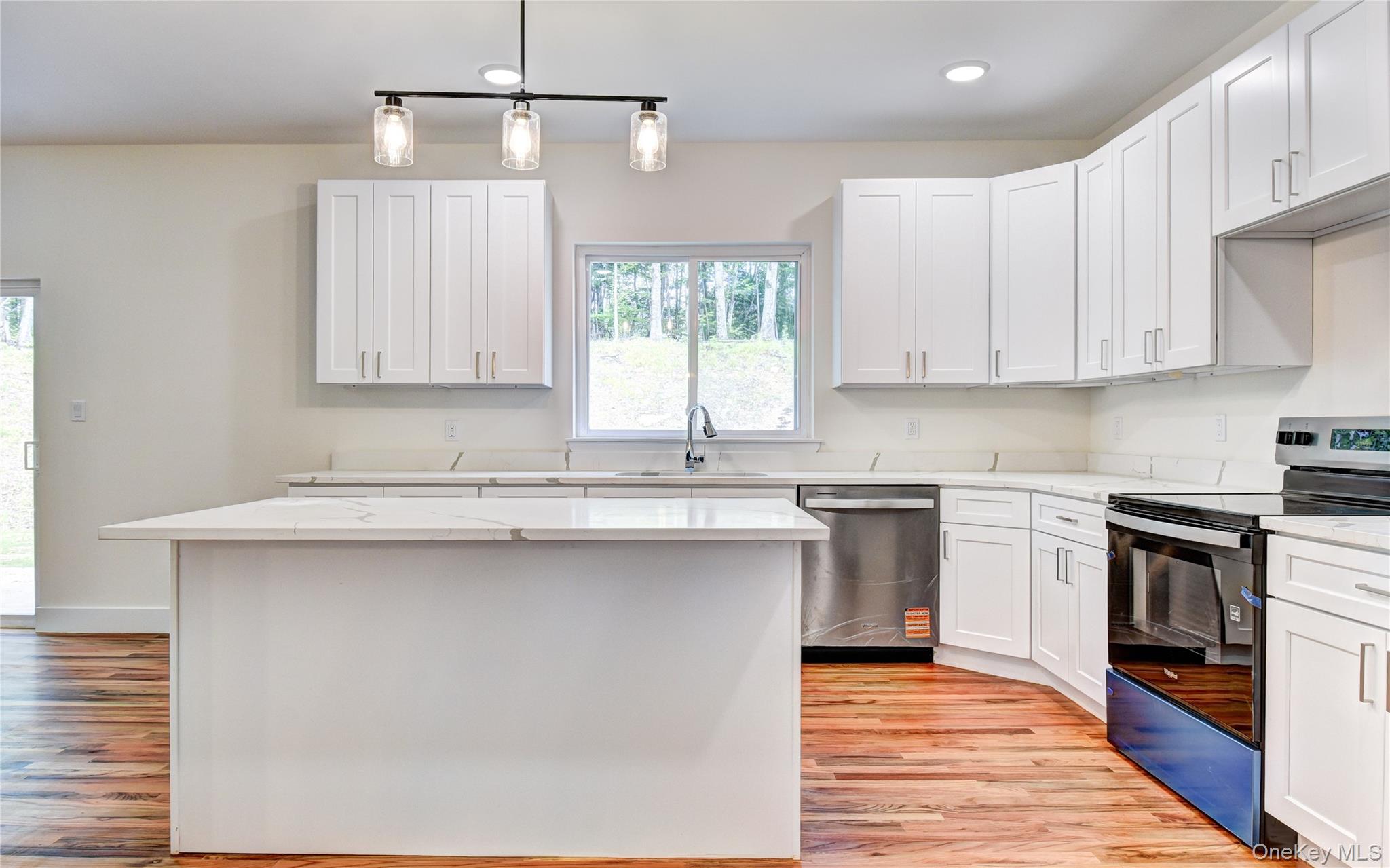 20 Wells Road Newburgh, NY 12550 - Photo 8 of 47 a kitchen with stainless steel appliances granite countertop a sink stove and refrigerator