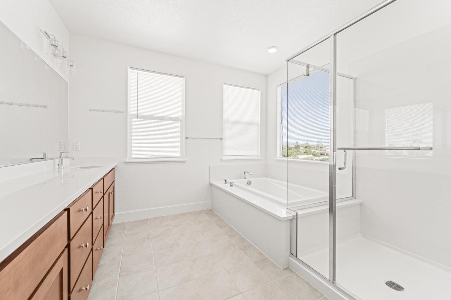 384 Ramos Ranch Road Oakley, CA 94561 - Photo 24 of 39 a bathroom with a tub sink shower and mirror