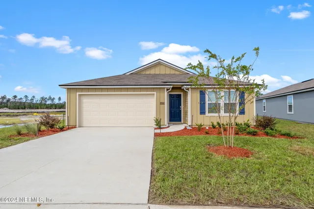 a front view of a house with porch and garden