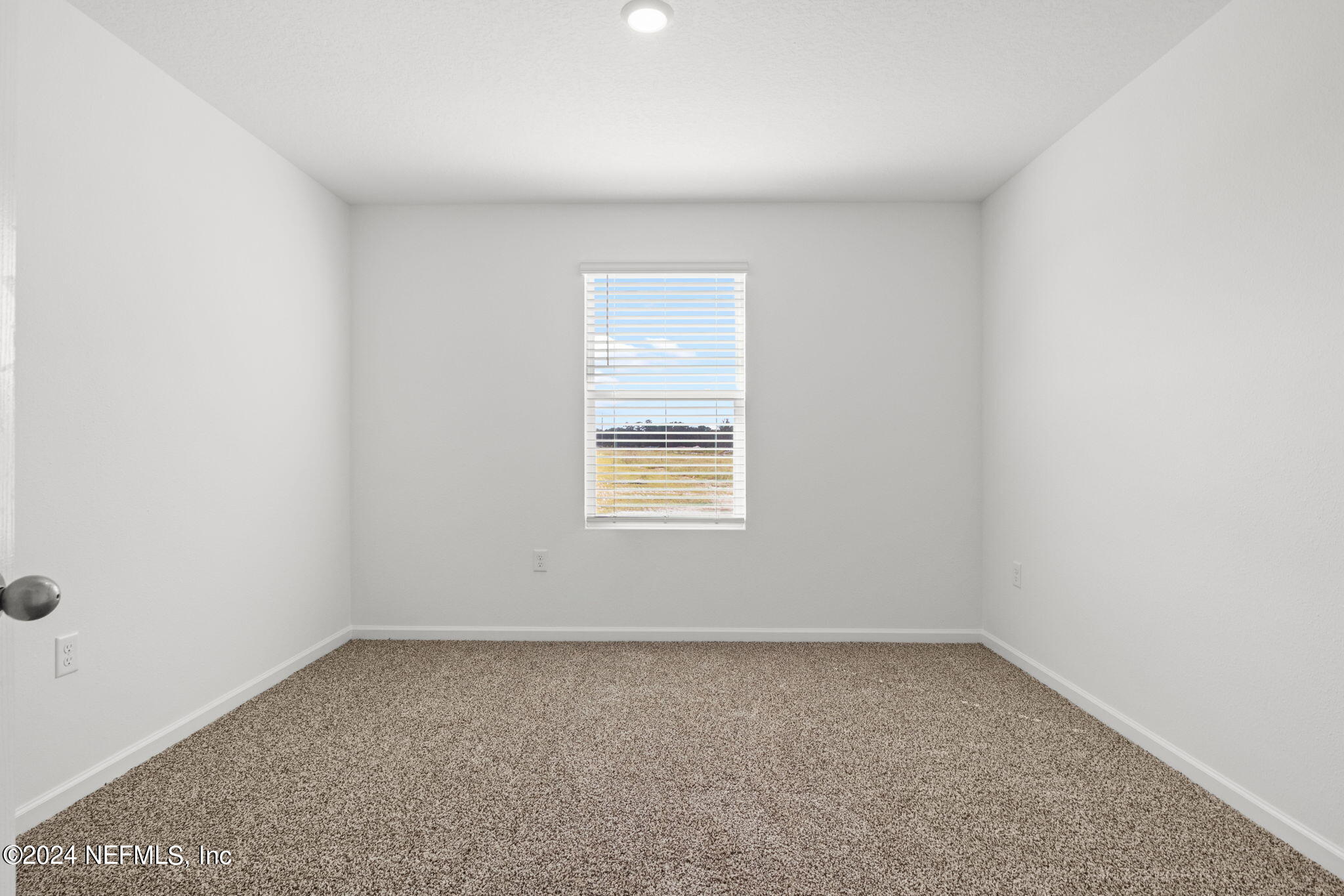 12573 Rubber Fig Terrace Jacksonville, FL 32218 - Photo 15 of 24 an empty room with a window