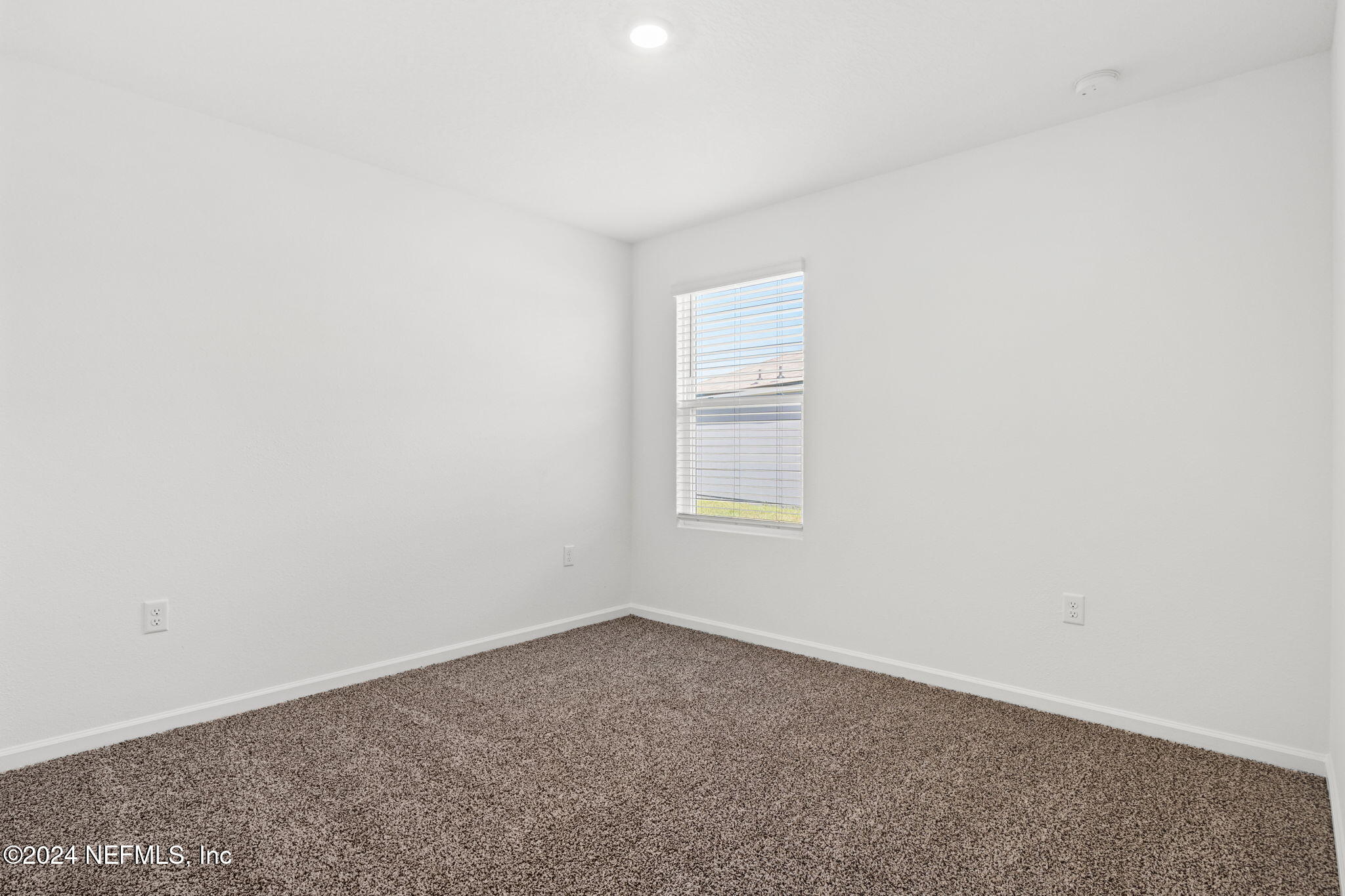 12573 Rubber Fig Terrace Jacksonville, FL 32218 - Photo 16 of 24 a view of a room that has a window in it