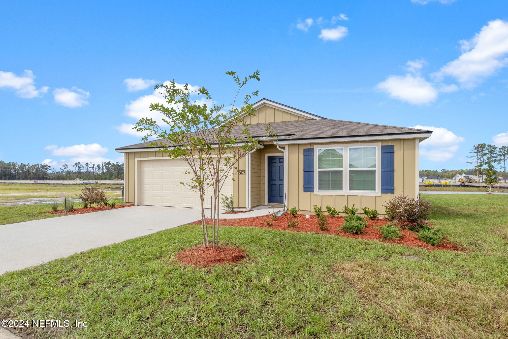 12573 Rubber Fig Terrace Jacksonville, FL 32218 - Photo 3 of 24 a front view of a house with garden