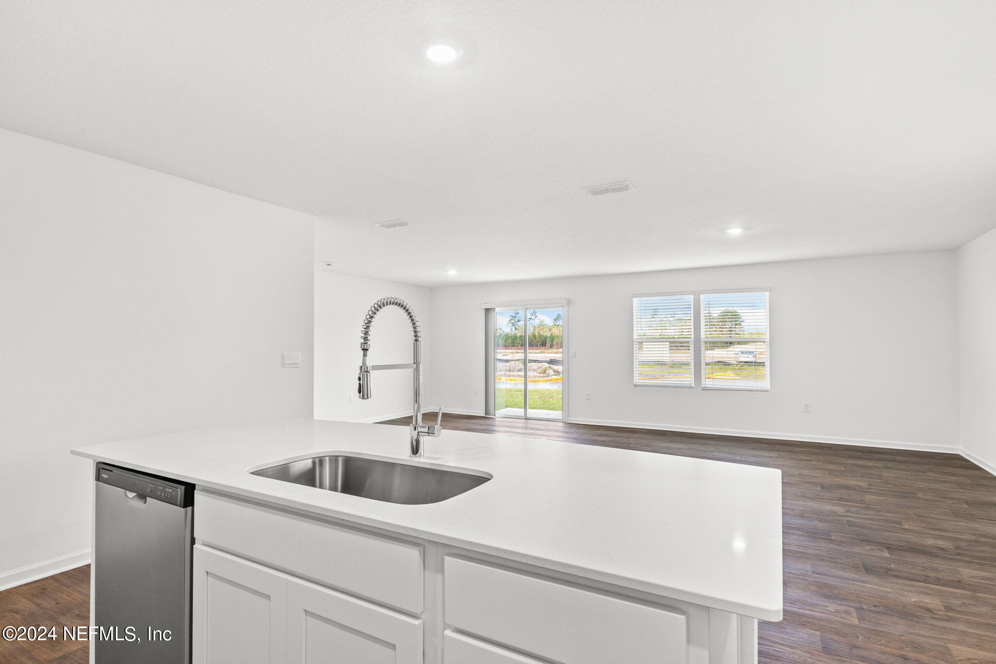 12573 Rubber Fig Terrace Jacksonville, FL 32218 - Photo 7 of 24 a kitchen with a sink cabinets and a window