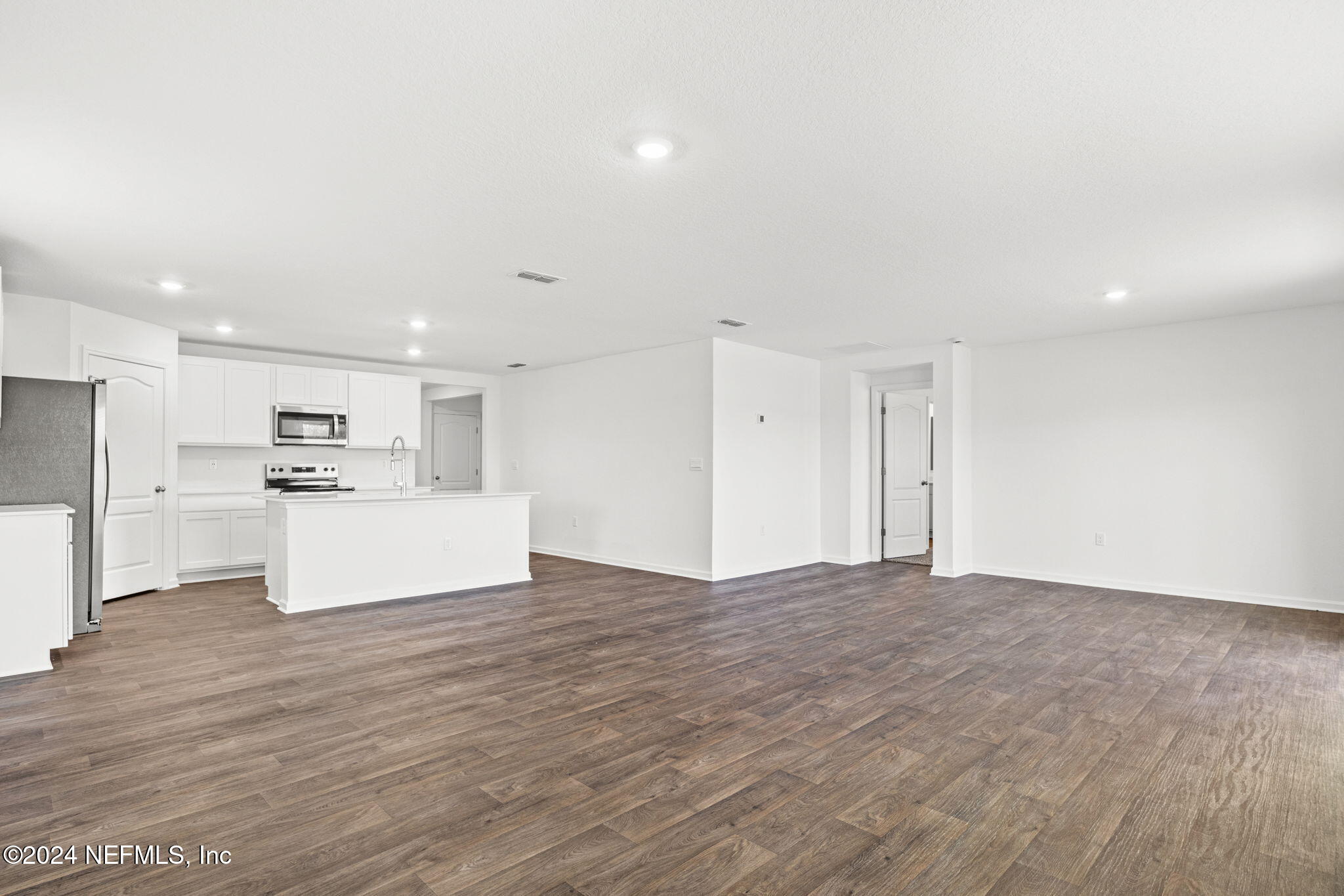 12573 Rubber Fig Terrace Jacksonville, FL 32218 - Photo 8 of 24 a view of kitchen with granite countertop cabinets and refrigerator