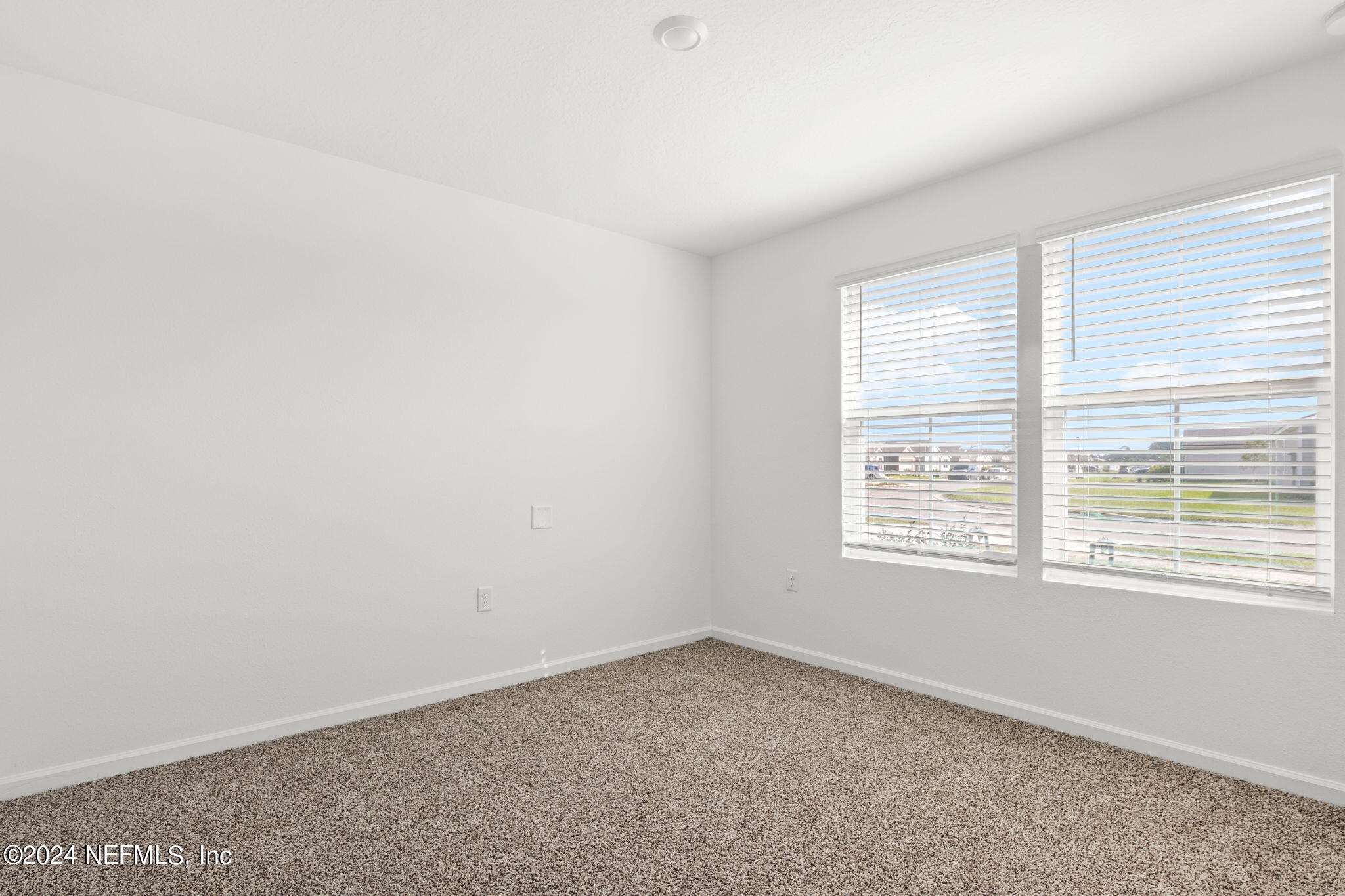 12573 Rubber Fig Terrace Jacksonville, FL 32218 - Photo 10 of 24 an empty room with a window