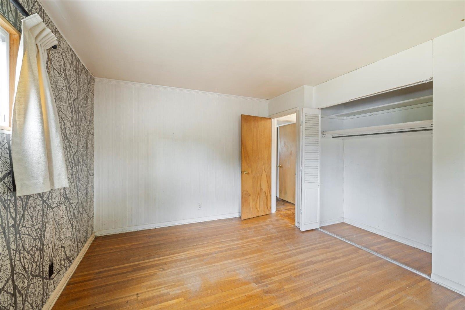 202 Suffolk Drive Hoyt Lakes, MN 55750 - Photo 17 of 33 Unfurnished bedroom with light wood-type flooring and a closet