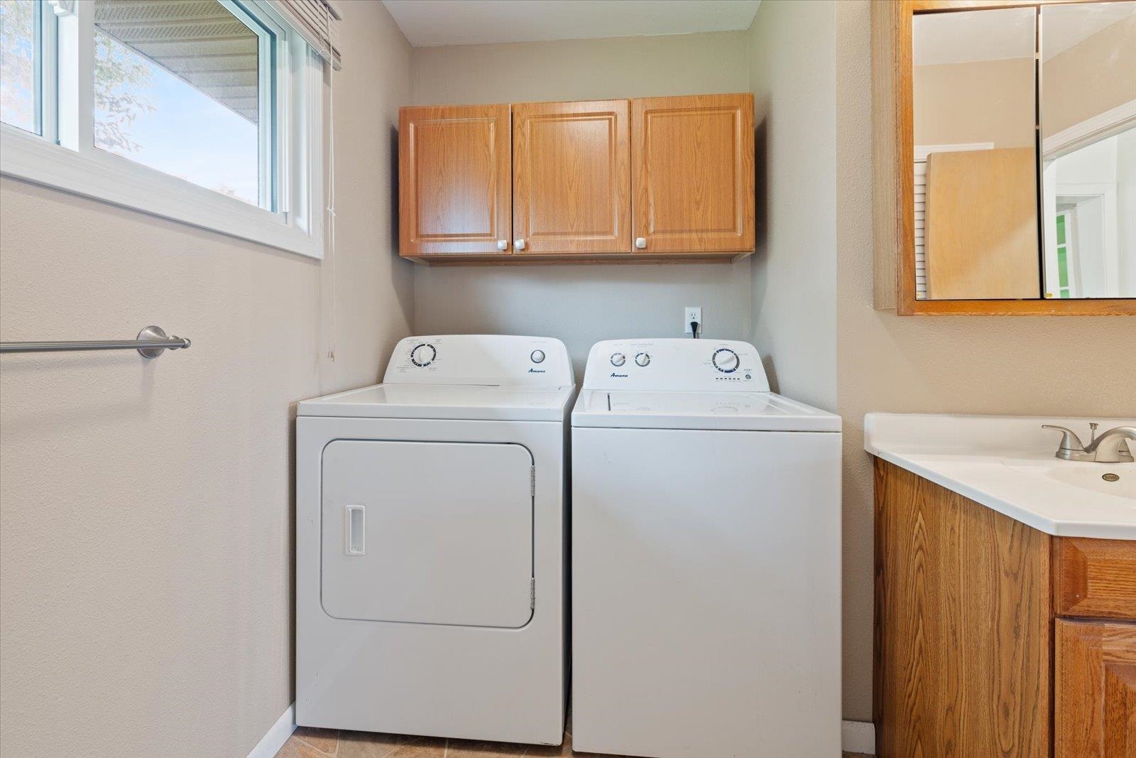202 Suffolk Drive Hoyt Lakes, MN 55750 - Photo 21 of 33 Washroom featuring cabinet space and independent washer and dryer