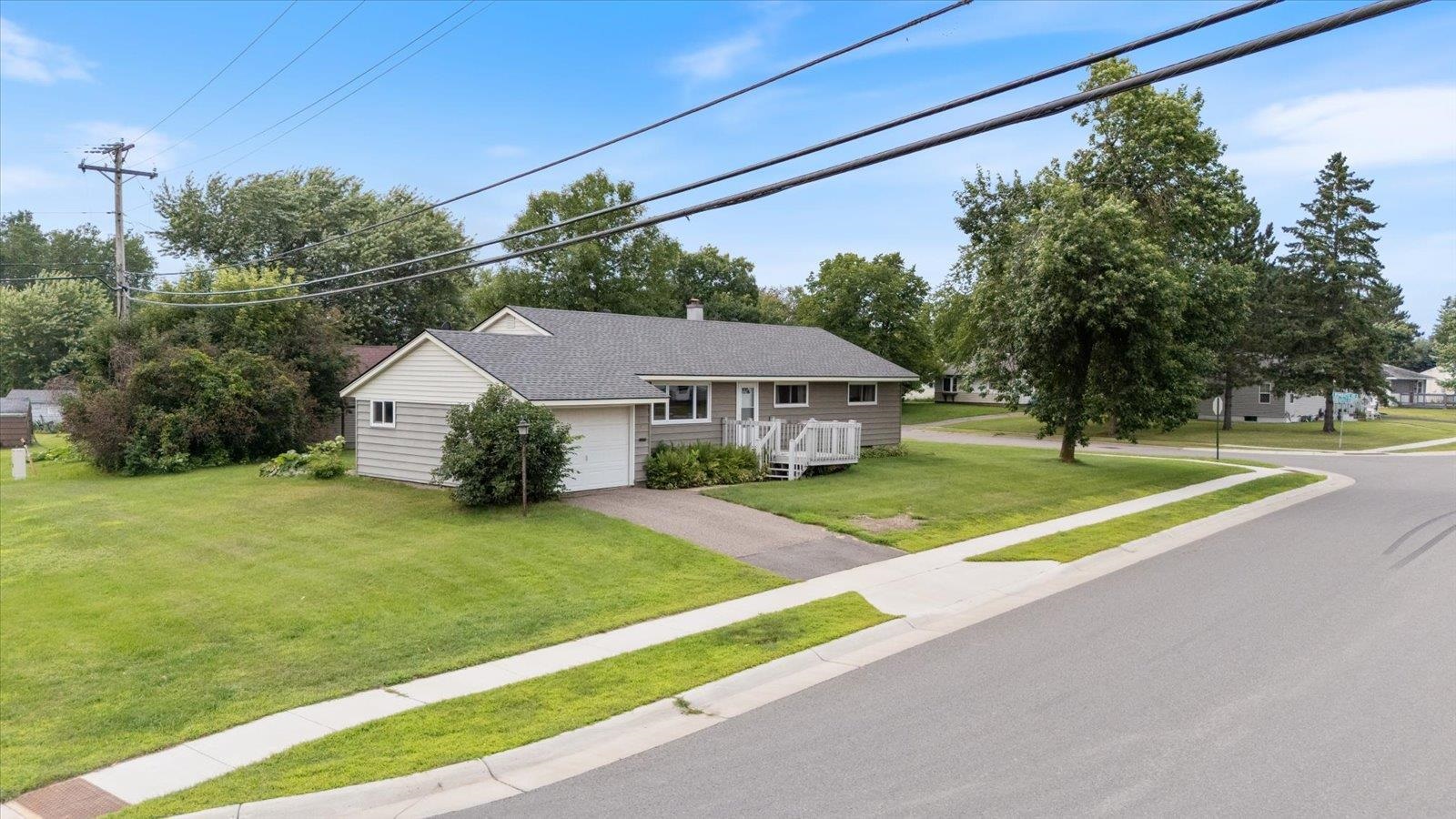 202 Suffolk Drive Hoyt Lakes, MN 55750 - Photo 33 of 33 Single story home featuring a chimney, a front yard, driveway, a garage, and roof with shingles