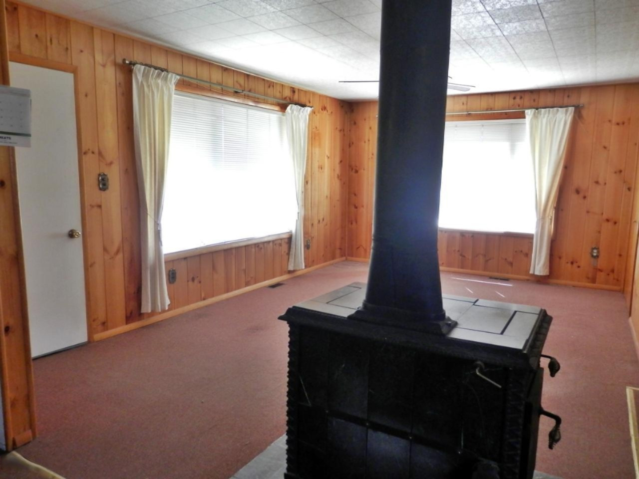 10230 Marilla Road Copemish, MI 49625 - Photo 3 of 26 Woodstove in living room
