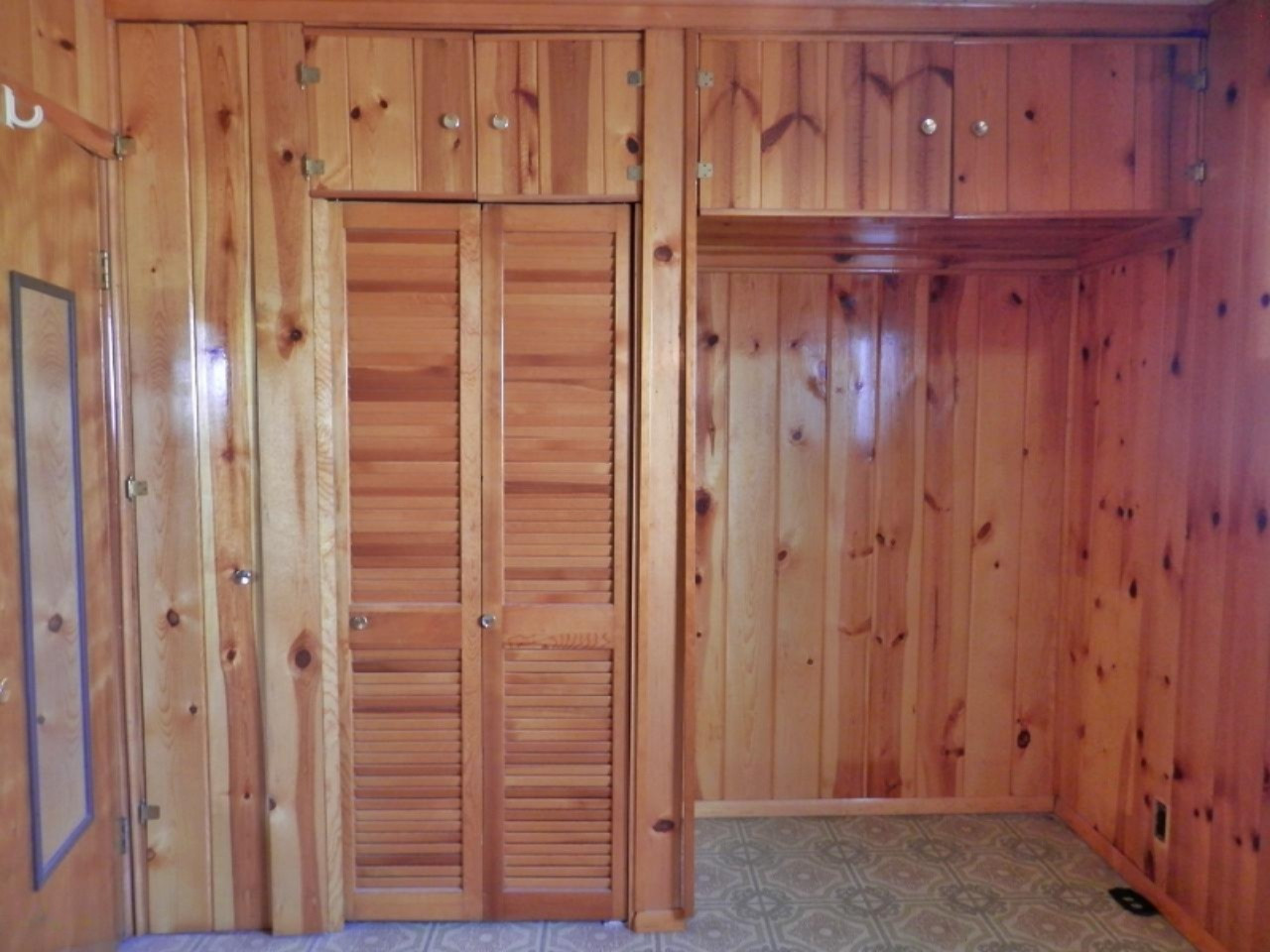 10230 Marilla Road Copemish, MI 49625 - Photo 7 of 26 Master bedroom closet wall