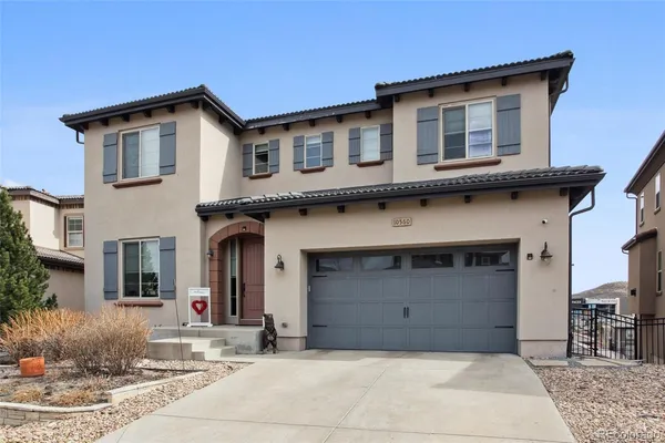 a front view of a house with garage