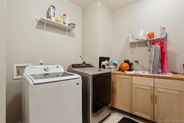 a utility room with dryer and washer