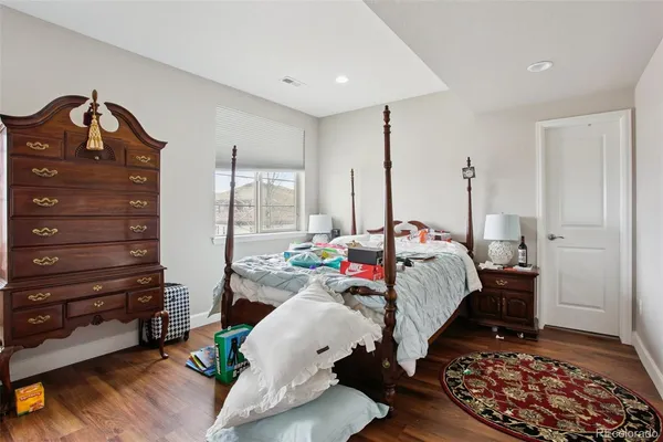 a bed room with a bed and a window