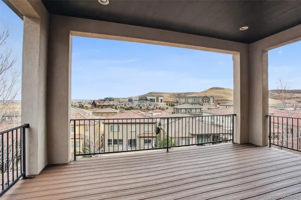 a view of a balcony with wooden floor