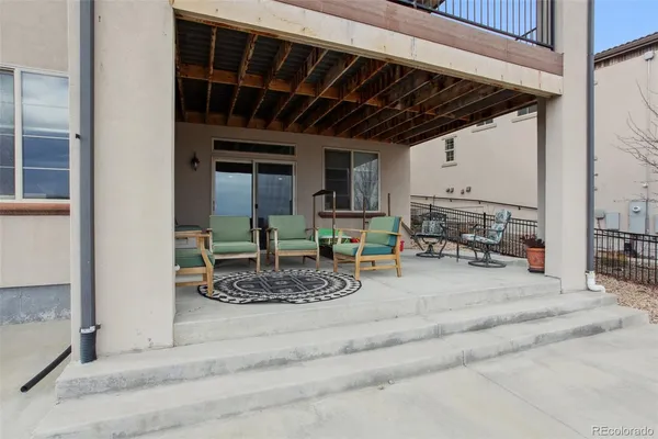 a room with wooden floor and furniture