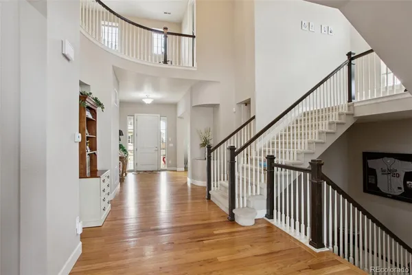 a view of an entryway with wooden floor