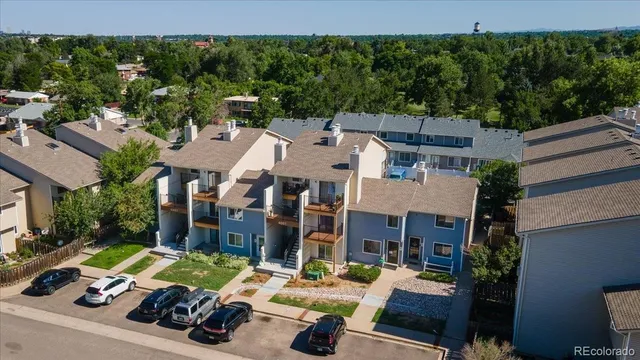 an outdoor space with patio furniture and garden view