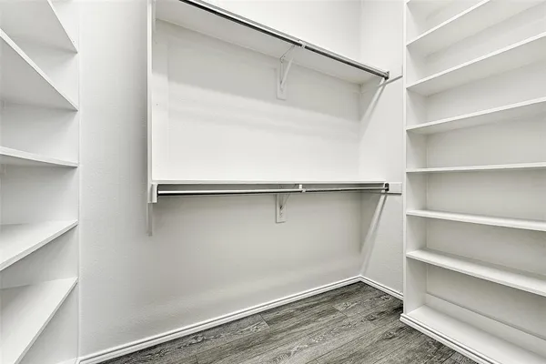 a view of an empty walk in closet