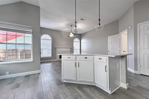 a view of a kitchen with electric appliances