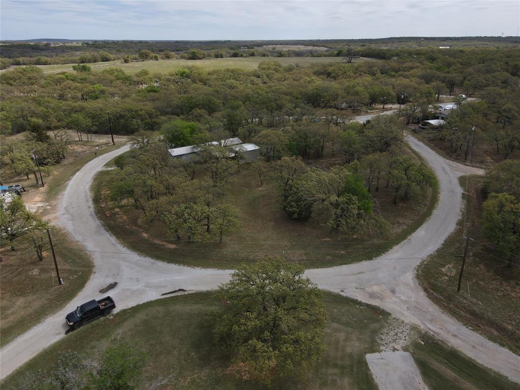 141 Seneca Trail Nocona, TX 76255 - Photo 3 of 8 an aerial view of a house with a yard